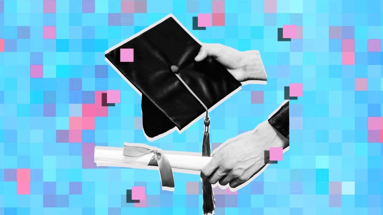 graduate holding diploma
